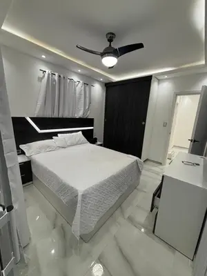 a bedroom with a bed and a ceiling fan at villa la pal de 4 in La Ureña