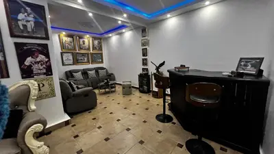 a living room with a couch and a table at Villa Robilu