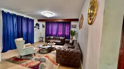 a living room with a couch and a table at Villa Robilu