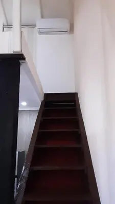 a staircase in a room with a stair case at Tortuga Cabarete Resindencial in Sosua