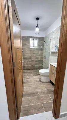 a bathroom with a toilet and a sink at VILLA 127 La Intensa Del Caribe in Pueblo Bavaro