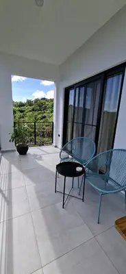 a patio with two chairs and a table on a balcony at SunSeaBeach Villa Iguana - 3 SZ - Strandnähe in Las Galeras