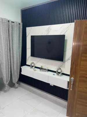 a flat screen tv sitting on top of a wall at EG suits rentals in San Felipe de Puerto Plata