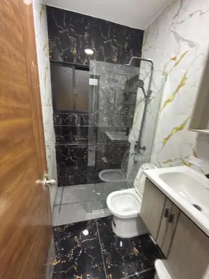 a bathroom with a toilet and a sink at EG suits rentals in San Felipe de Puerto Plata