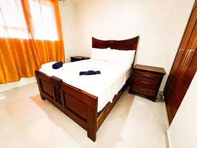 a bedroom with a large bed and a window at Serene Penthouse near Homs Hospital in El Ejido