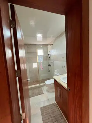 a bathroom with a shower and a toilet and a sink at Caribbean luxury in Sosúa