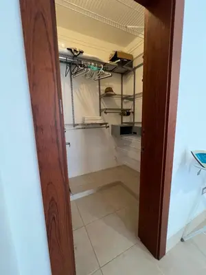 a walk in closet with a glass door at Caribbean luxury in Sosúa