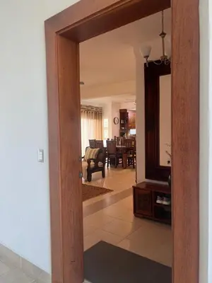 a hallway with a mirror and a living room at Caribbean luxury in Sosúa