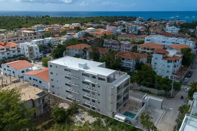 an aerial view of a city with buildings and the ocean at Elegant Coastal Escape Spacious 2BR Bayahibe in San Rafael del Yuma