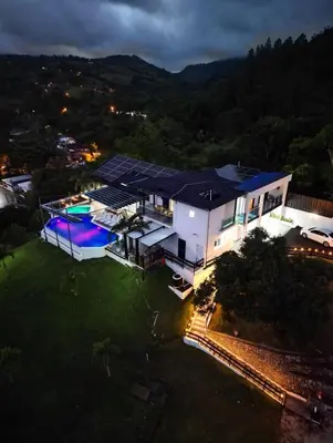 an aerial view of a house with a swimming pool at Villa Ana in Santiago de los Caballeros