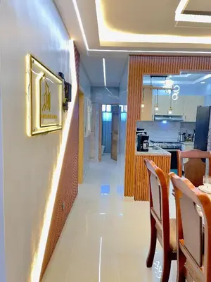 a corridor of a restaurant with a table and chairs at Skyline Stays in La Viva