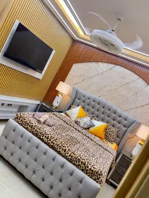 a view of a living room with a couch and a television at Skyline Stays in La Viva
