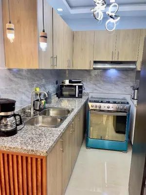 a kitchen with a sink and a stove at Skyline Stays in La Viva