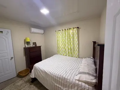 a small bedroom with a bed and a window at Excelente lugar en montecristi muy céntrico tu mejor opción in San Fernando de Monte Cristi