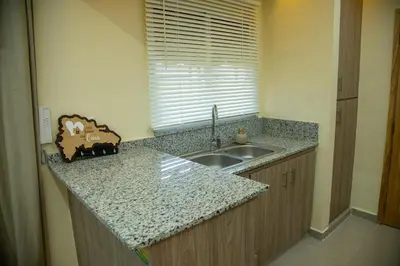 a kitchen counter with a sink and a window at Casa Rosario in La Grúa