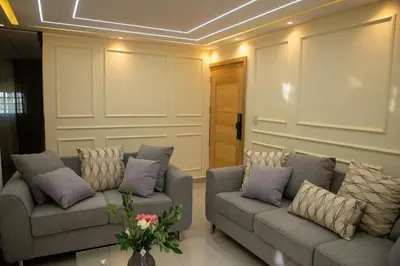 a living room with two couches and a table at Casa Rosario in La Grúa