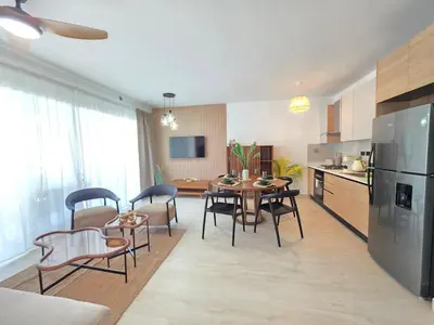 a kitchen and dining room with a table and chairs at Estrella Garden Shaula 104 New Modern Apartment in La Laguna
