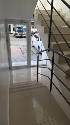 a white car is parked in a parking lot at Vacaciones809 in Juan López