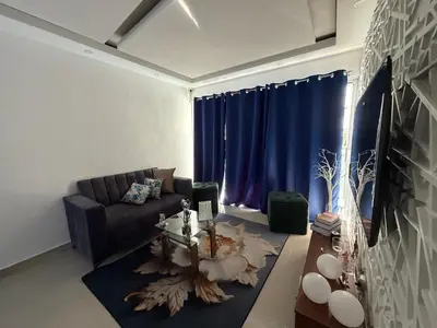 a living room with a couch and a table at Vacaciones809 in Juan López