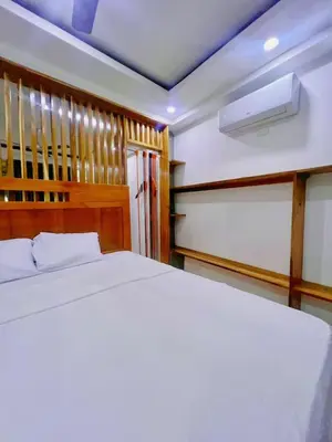 a bedroom with a white bed and a ceiling at Villa Emili in Las Terrenas