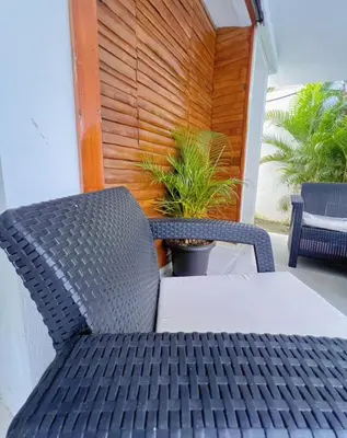 a table and chair sitting on a patio at Villa Emili in Las Terrenas