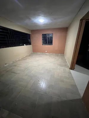 an empty room with a tile floor and a window at Rincón Paraíso Cheché in Dajabón