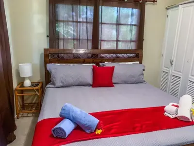 a bedroom with a bed with two stuffed animals on it at Villa 17M in Sosúa