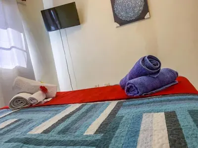 a bed with towels sitting on top of it at Villa 17M in Sosúa