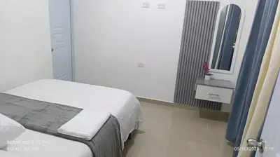 a hospital room with a bed and a mirror at Sol y Arena in Pedernales