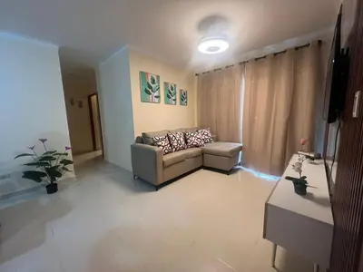 a living room with a couch and a television at Los manglares in La Cana