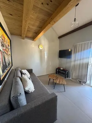 a living room with a couch and a table at Apartment bayahibe in Bayahibe