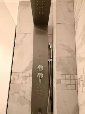 a shower with a glass door in a bathroom at Exclusive 2BR Apartment Punta Cana in Punta Cana