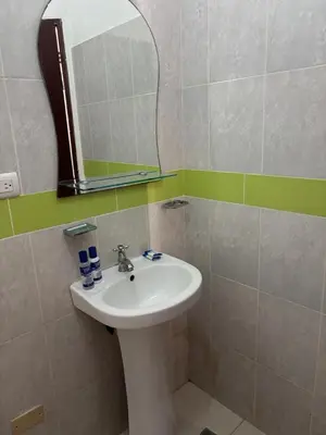 a bathroom with a sink and a mirror at Casa Bonita by Mireya in Bayahibe
