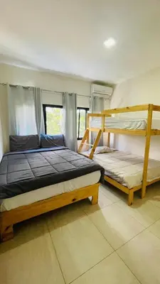 a bedroom with two bunk beds in a room at oceanfront apartment in La Puntica de Juan Dolio