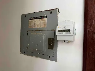 a metal box on a wall with a meter at Plaza Achim 2BR APT heart of nightlife area in Sosúa