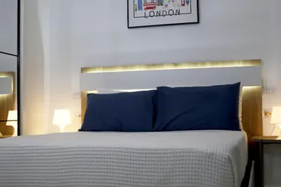 a bed with blue pillows in a bedroom at Spacious 3BR Residence in Punta Cana by Infinity Homes in Punta Cana