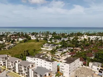 an aerial view of a city with buildings and the ocean at Rooftop Penthouse Jacuzzi, 2 Pools Playa Popy 500m in Las Terrenas