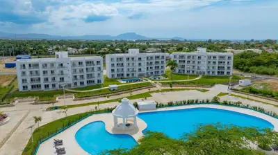 an overhead view of a building and a swimming pool at Prime Apartment with Fast Internet & Washer in SOV in Sosúa