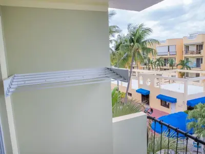 a view of the pool from the balcony of a resort at Garden Condos 5 - Ultra Modern Apartment in Sosua in Sosúa