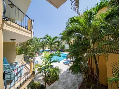 a view of the pool from the balcony of a resort at Garden Condos 10 2BR Apt in Sosua Strip in Sosúa