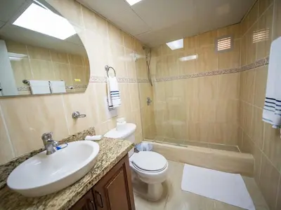 a bathroom with a sink and a toilet and a shower at Garden Condos APT 30 Lovely 1BR Condo with Pool in Sosúa