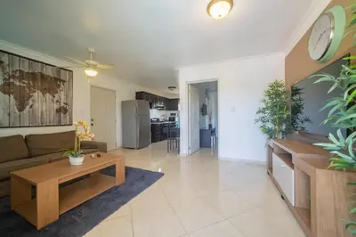 a living room with a couch and a table at Garden Condos 35 Best Stylish apartment in Sosua in Sosúa