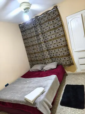 a bedroom with a bed with a headboard at Espacio acogedor y funcional in SJM