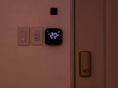 an alarm clock on the door of a room at Garden Condos 39 Ultra modern apartment in Sosua in Sosúa