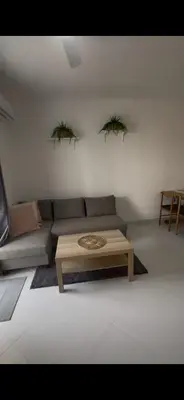 a living room with a couch and a coffee table at Maravilla Bayahibe , Stylish Apartment, Pool a Wifi in Bayahibe