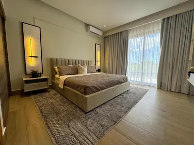 a bedroom with a bed and a large window at Luxury Villa in Punta Cana in Punta Cana