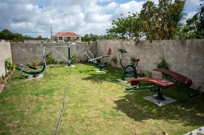 a group of exercise equipment in a yard at Presmita rose 24 in Punta Cana