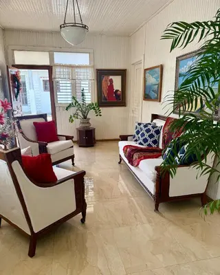 a living room with a couch and two chairs at Exclusive Beachside House with Private Backyard in Río San Juan
