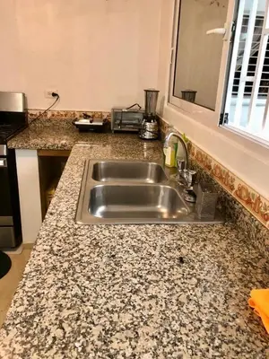a kitchen counter with a stainless steel sink at Exclusive Beachside House with Private Backyard in Río San Juan