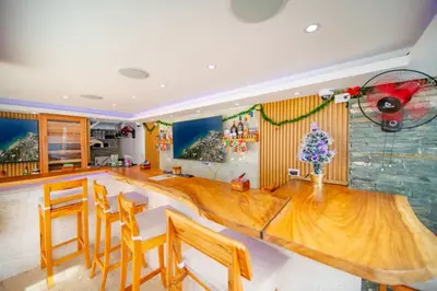 a dining room with a large wooden table and chairs at Casa de Compai Unit 4 Comfort in Central Sosua in Sosúa